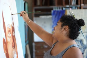 Tolbert’s canvases are large, larger than she is.  