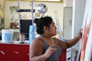 Tolbert works on her newest painting.