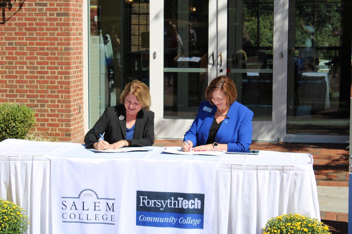 On October 10th, 2019, Sandra Doran (left), President of Salem Academy and College, and Janet Spriggs (right), President of Forsyth Technical Community College, signed an Articulation Agreement between their respective schools. Photo by Holli Burroughs