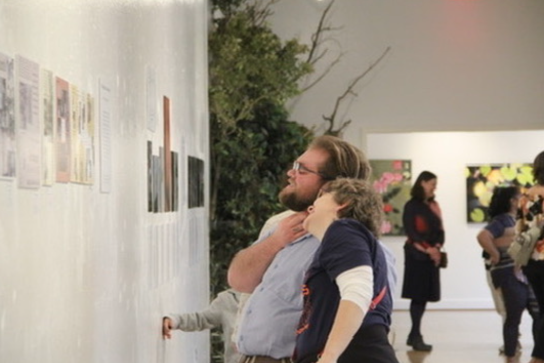 Alums and now faculty members, Elijah Sigler and Dr. Sharee Fowler, share a moment while looking at The Salemite’s exhibit.